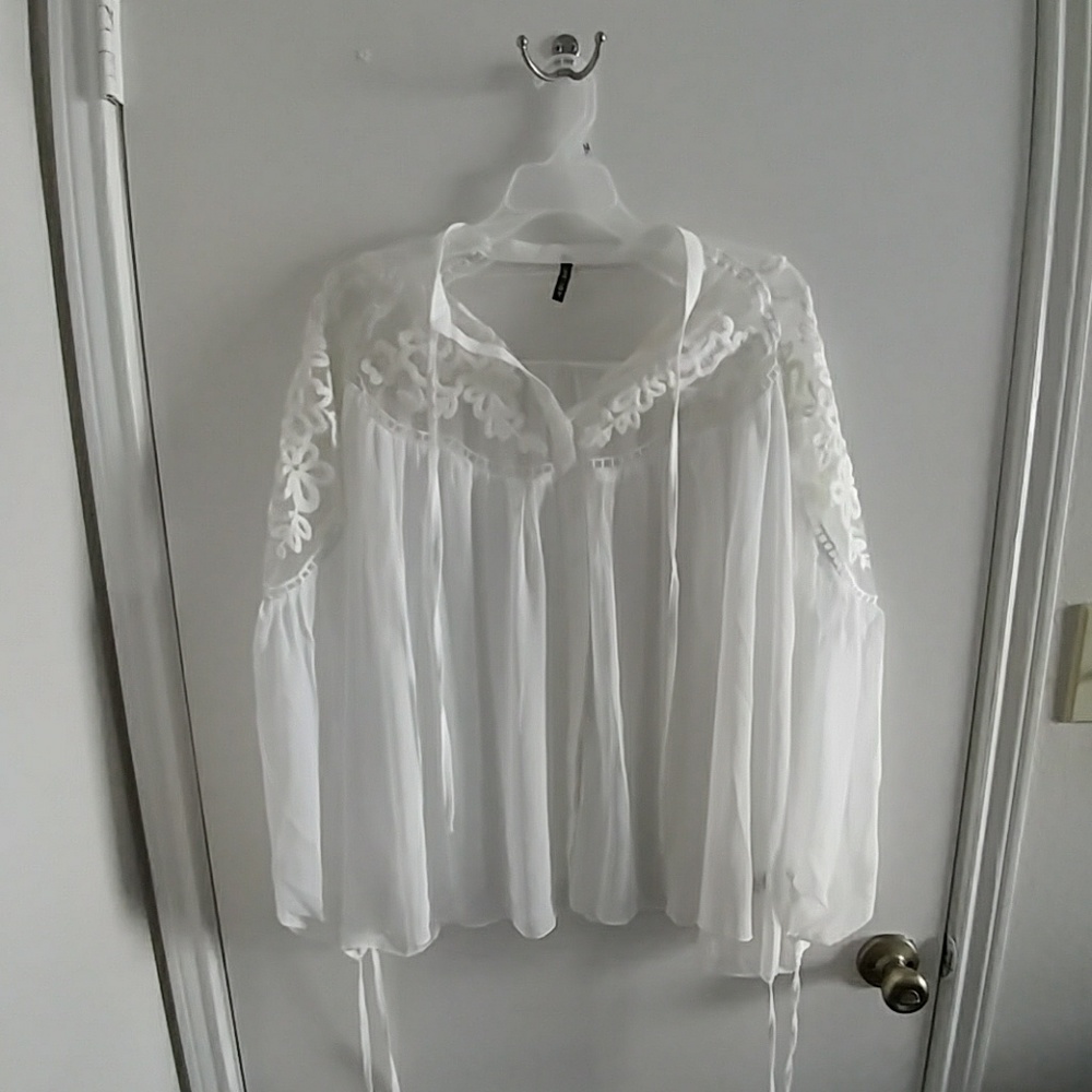 Laced white blouse with floral embrorded detailing